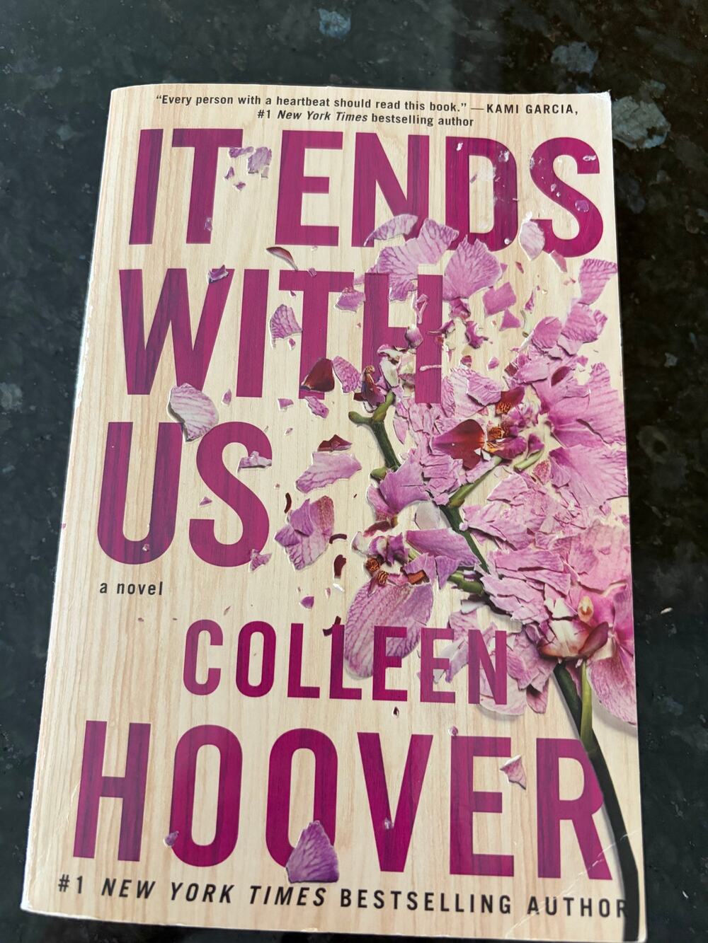 "It Ends With Us" by Colleen Hoover paperback book